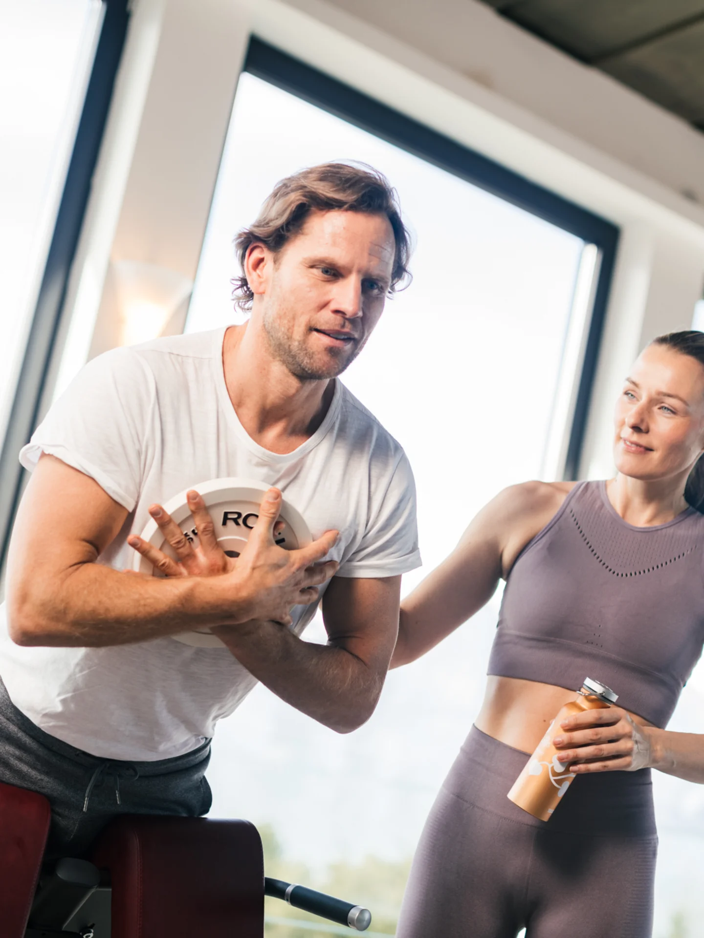 Fitness coach with man