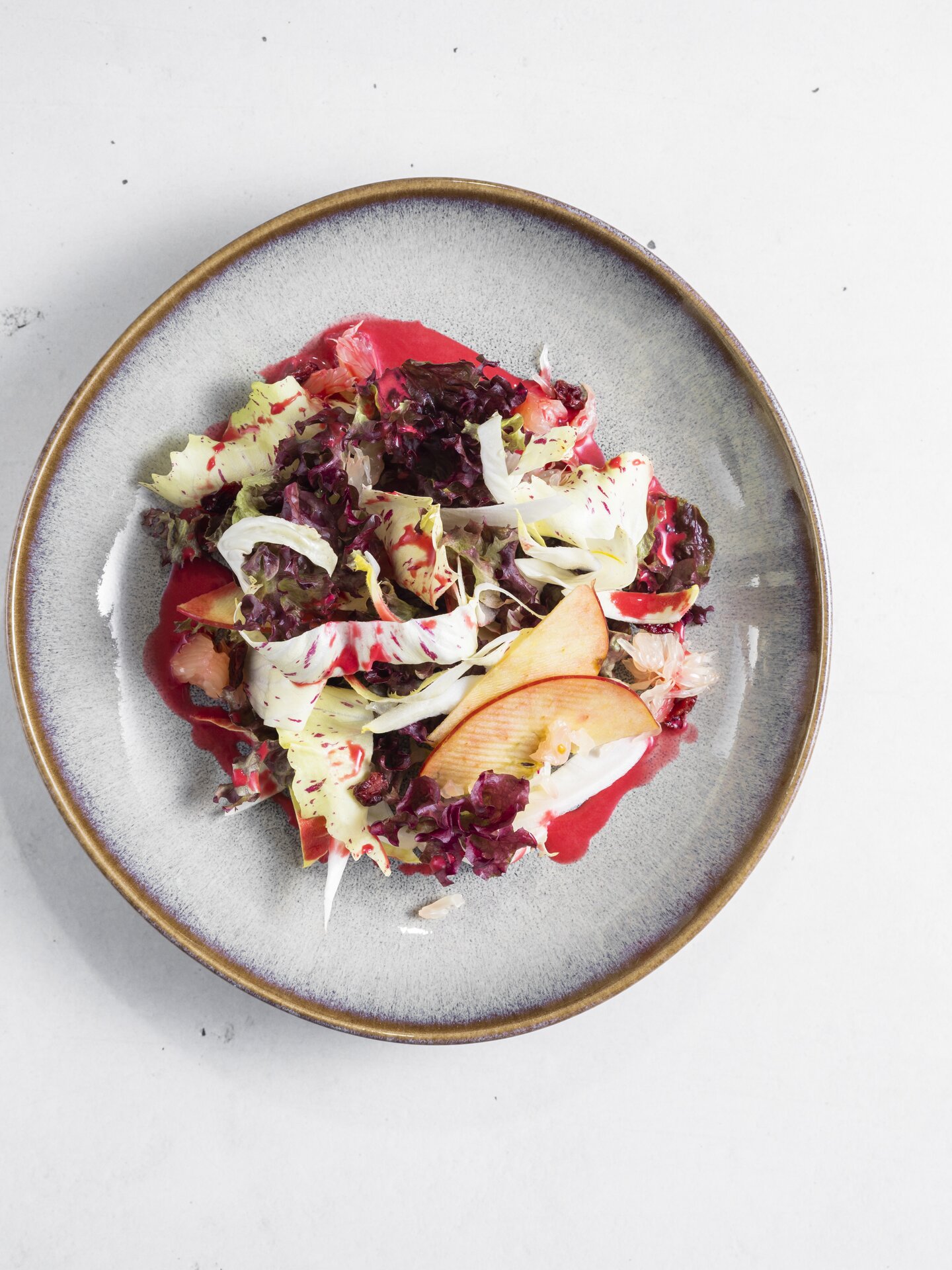 Plate with salad, apples and beetroot