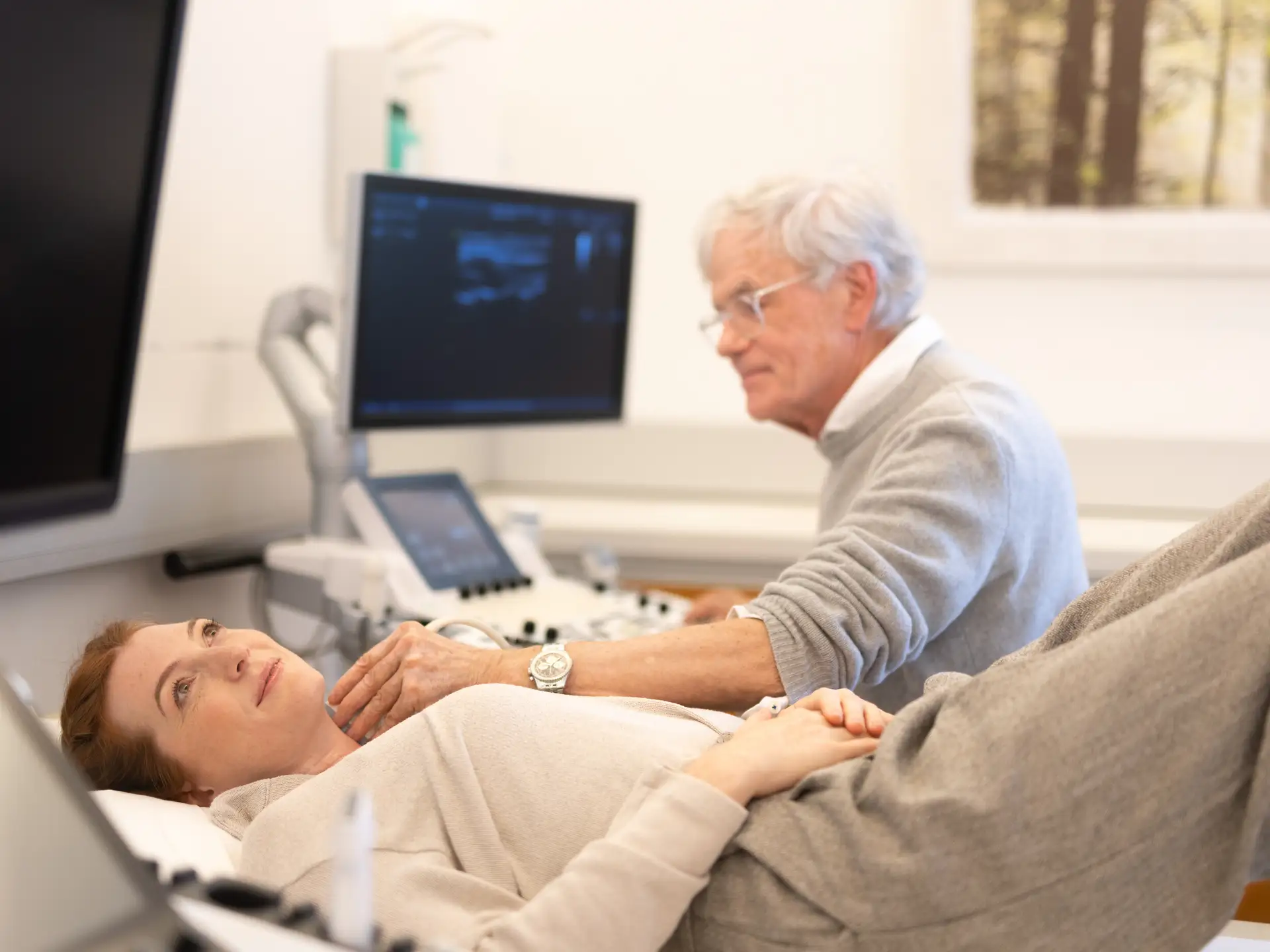 Woman lying down during carotid artery ultrasound examination