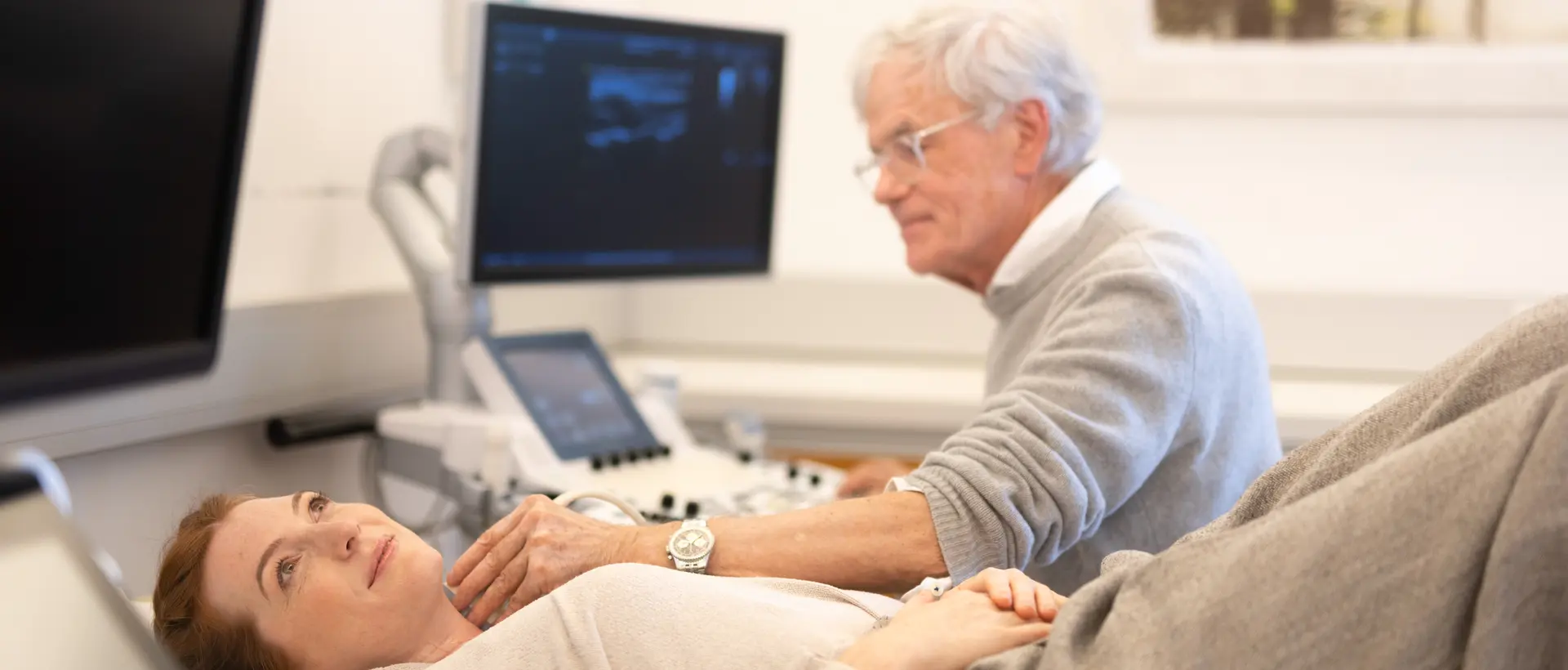 Woman lying down during carotid artery ultrasound examination
