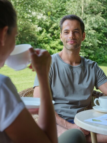 Couple drinking tea in the garden 