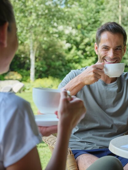 Couple drinking tea in the garden 