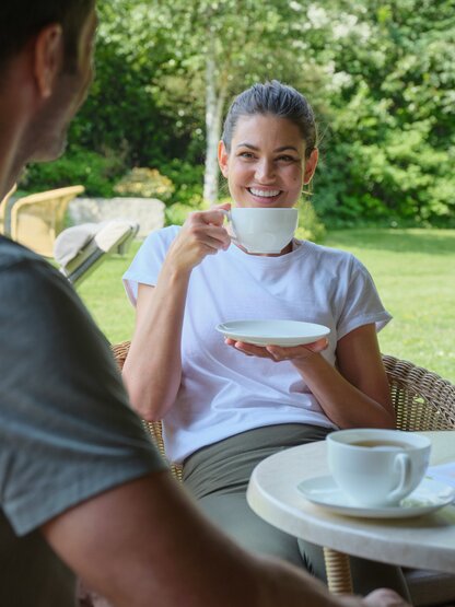 Couple drinking tea in the garden 