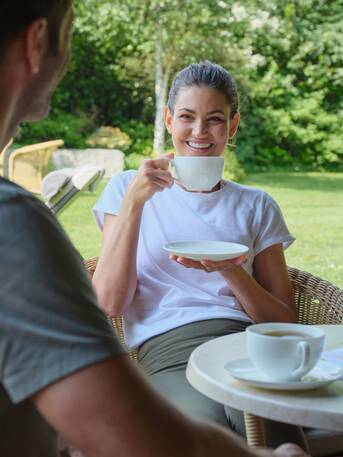 Couple drinking tea in the garden 