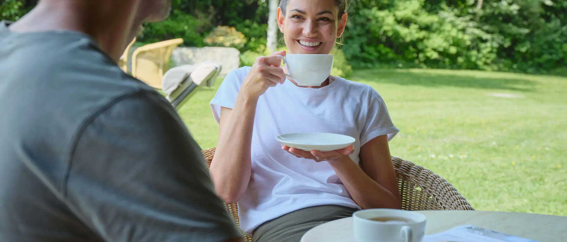 Couple drinking tea in the garden 