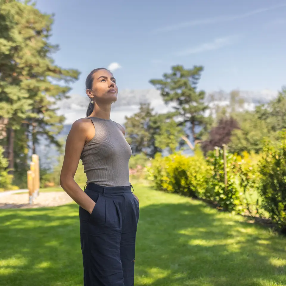 women enjoys the sun in the garden
