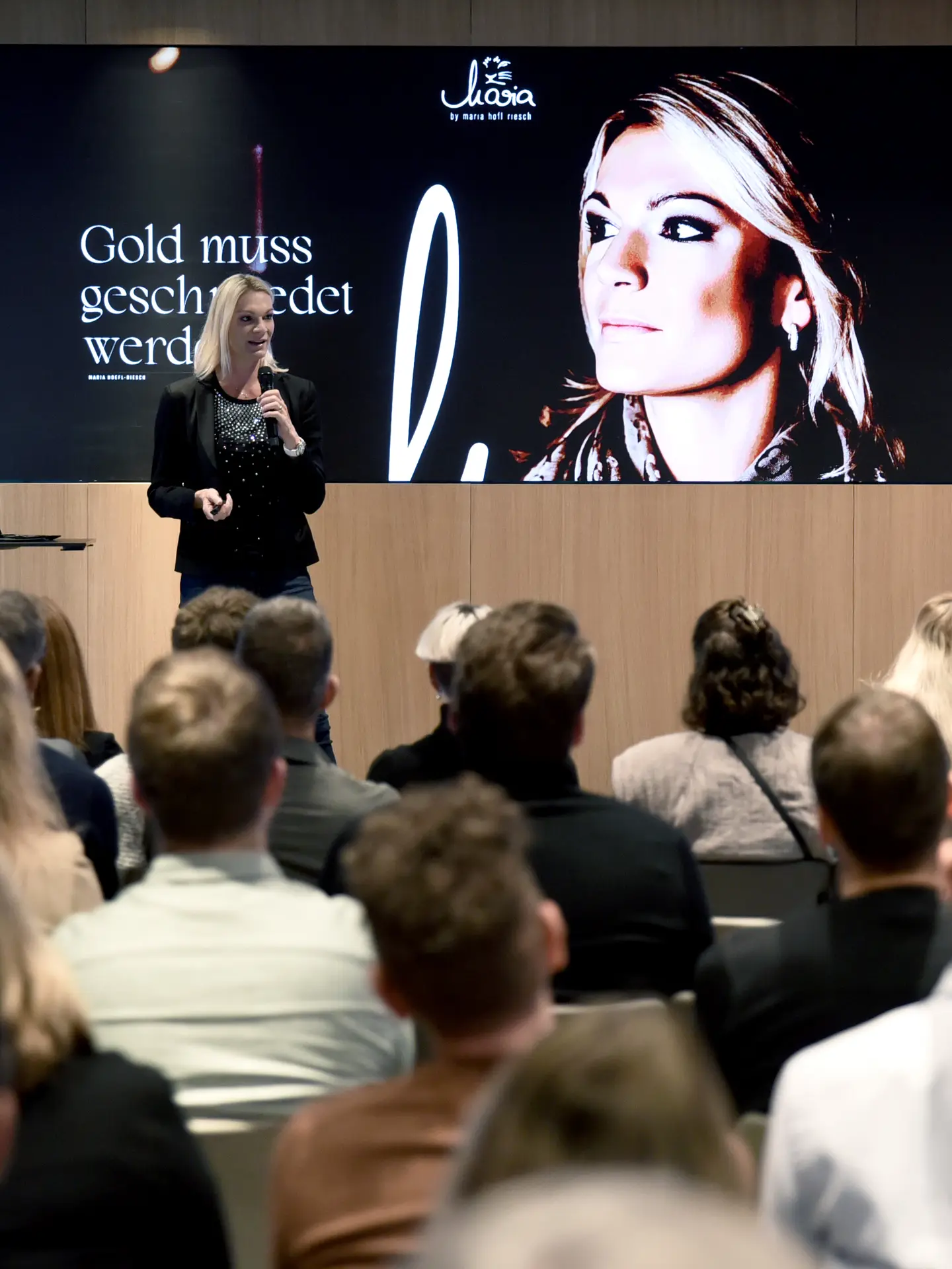 Maria Höfl-Riesch giving a keynote speech at Park Igls